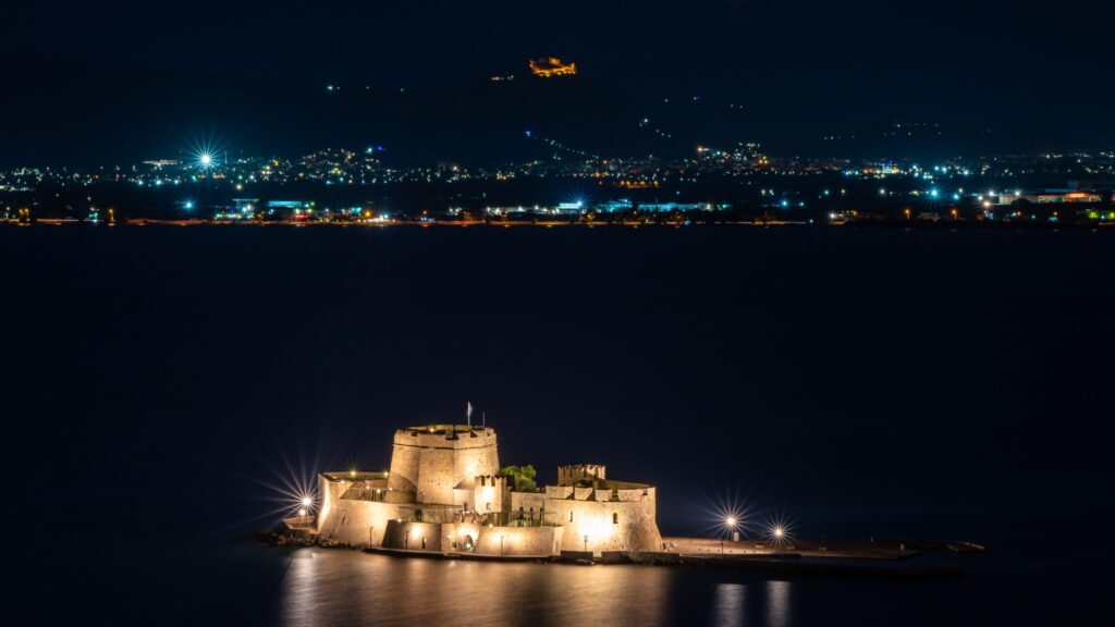 Aerial night view of Bourtzi and Palamidi Nafplio private tour
