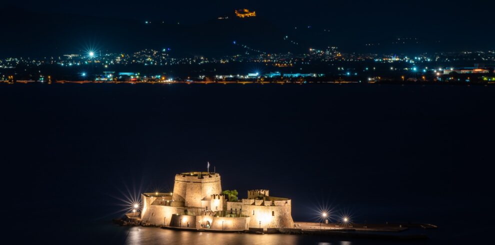 Aerial night view of Bourtzi and Palamidi Nafplio private tour